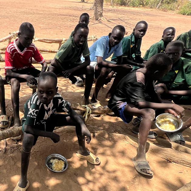 Orphans having a meal