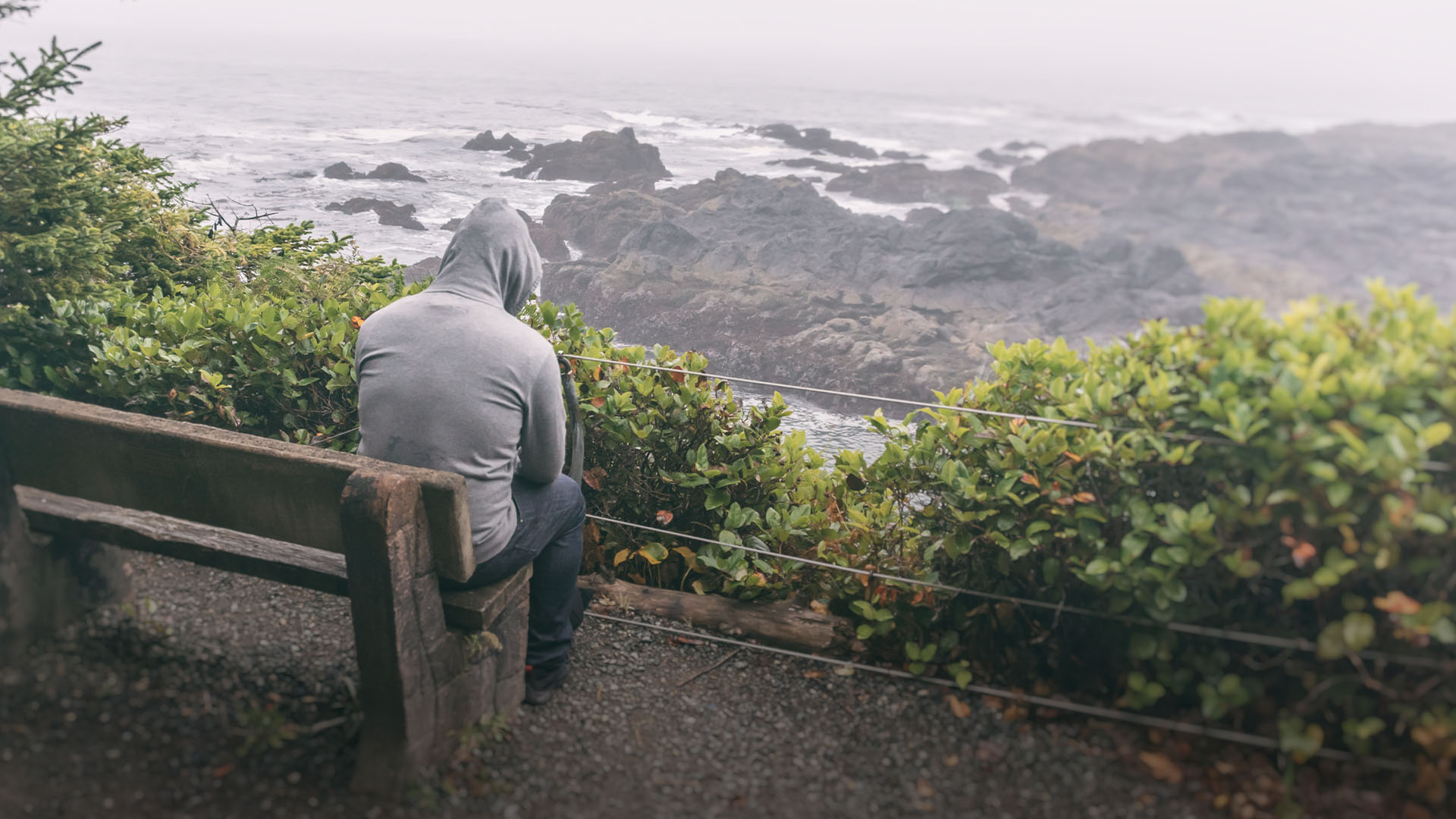 man praying overlooking a mountain
