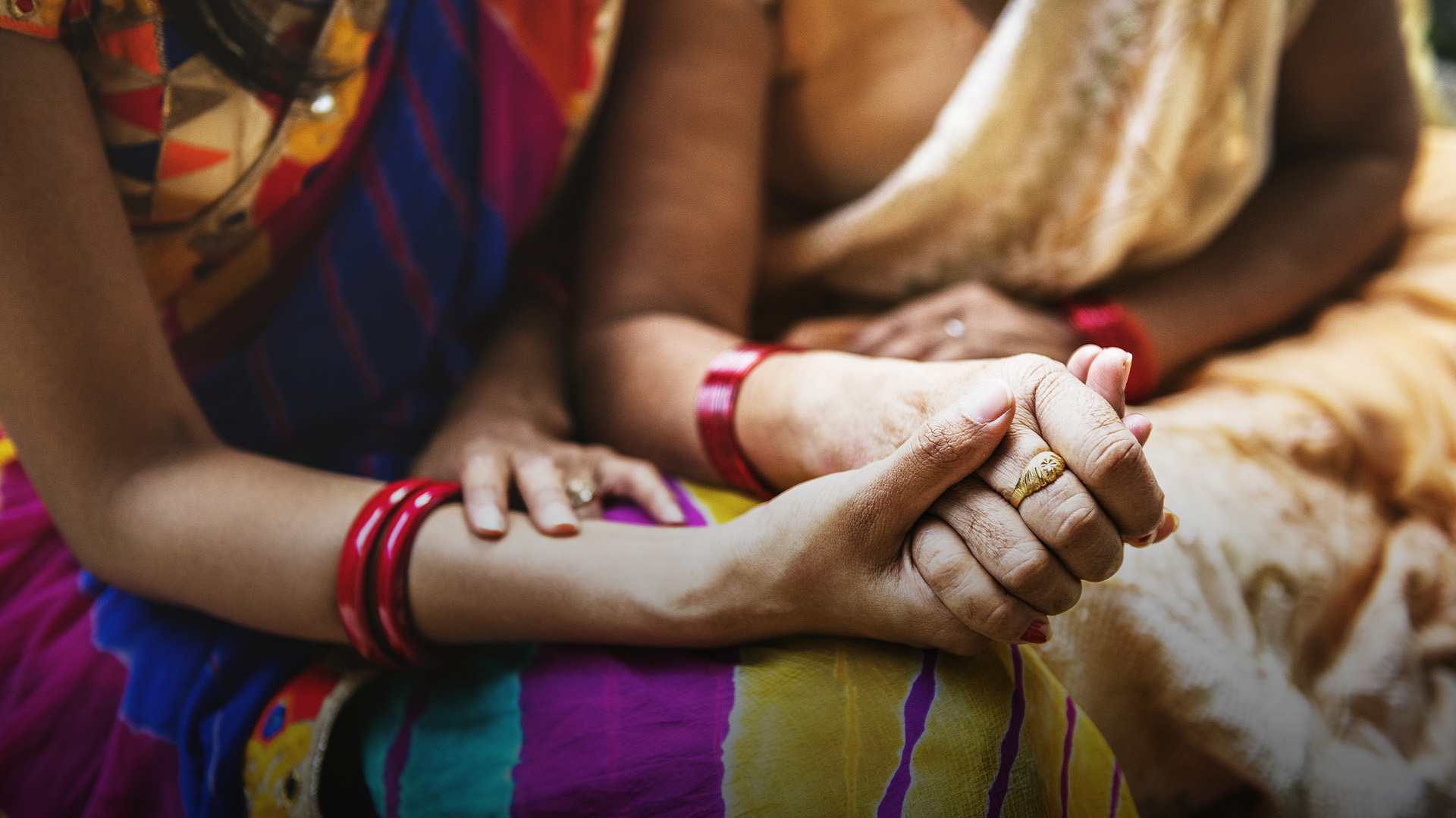 indian woman comforting friend