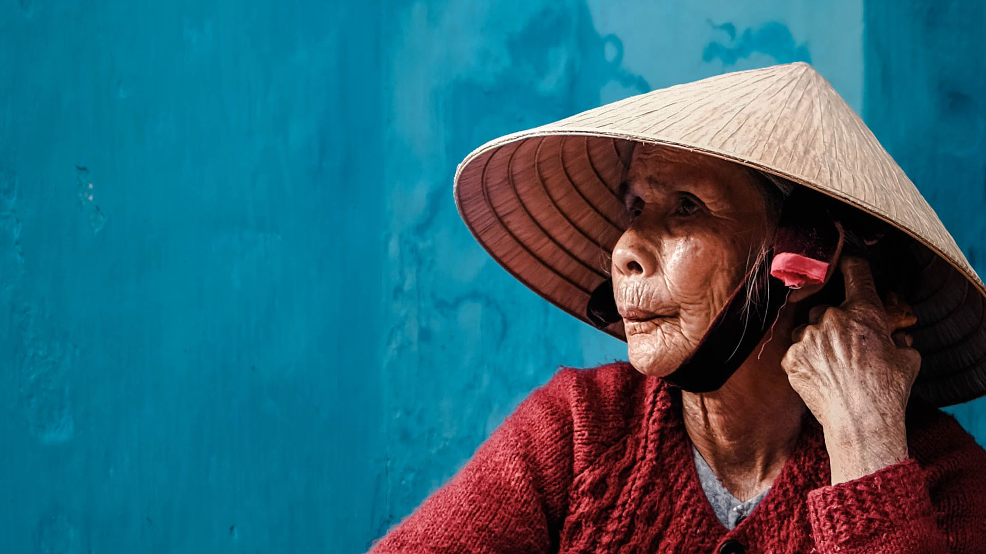 Elderly Asian woman looking off to the distance