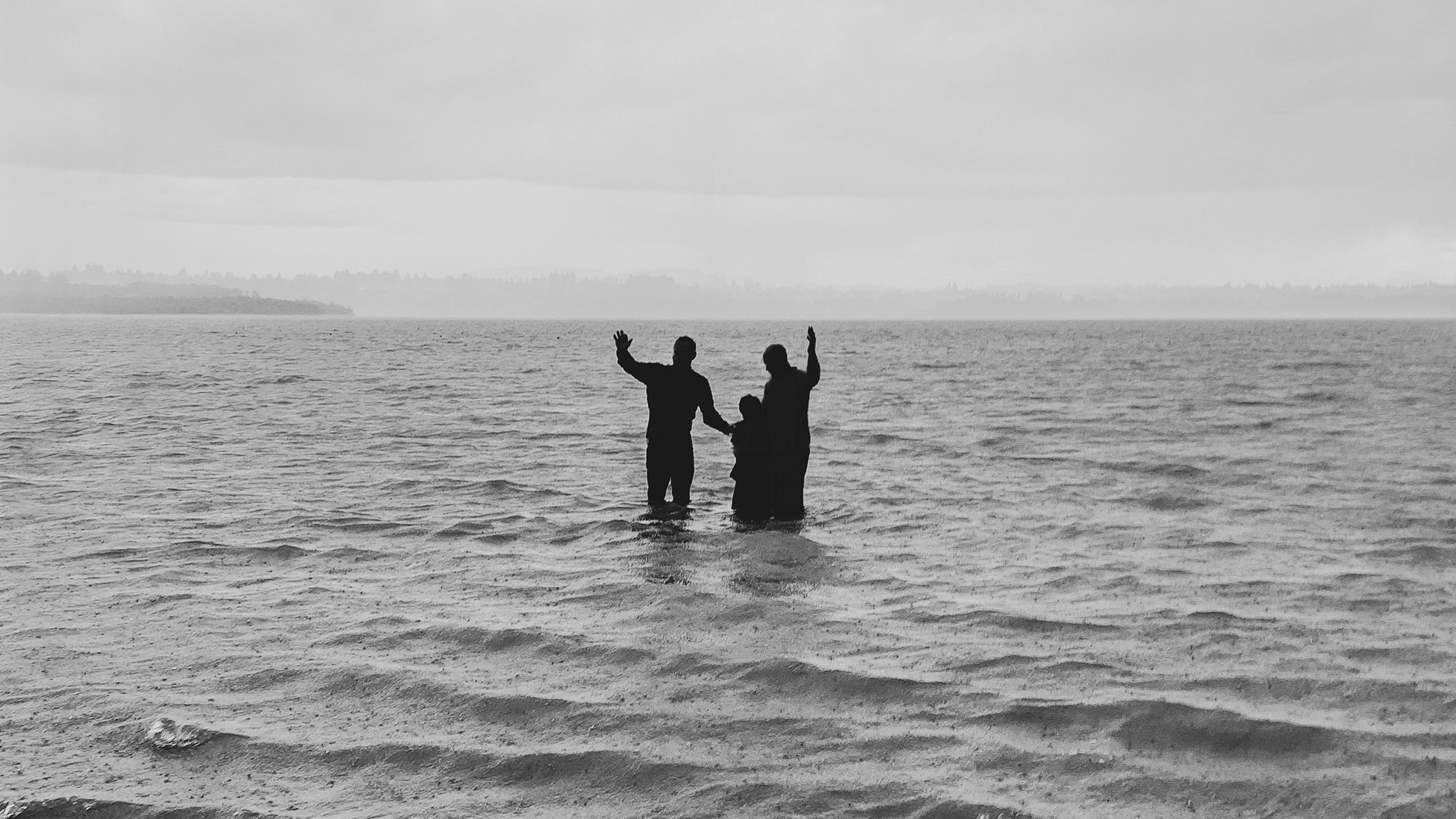 Man and Child getting baptized