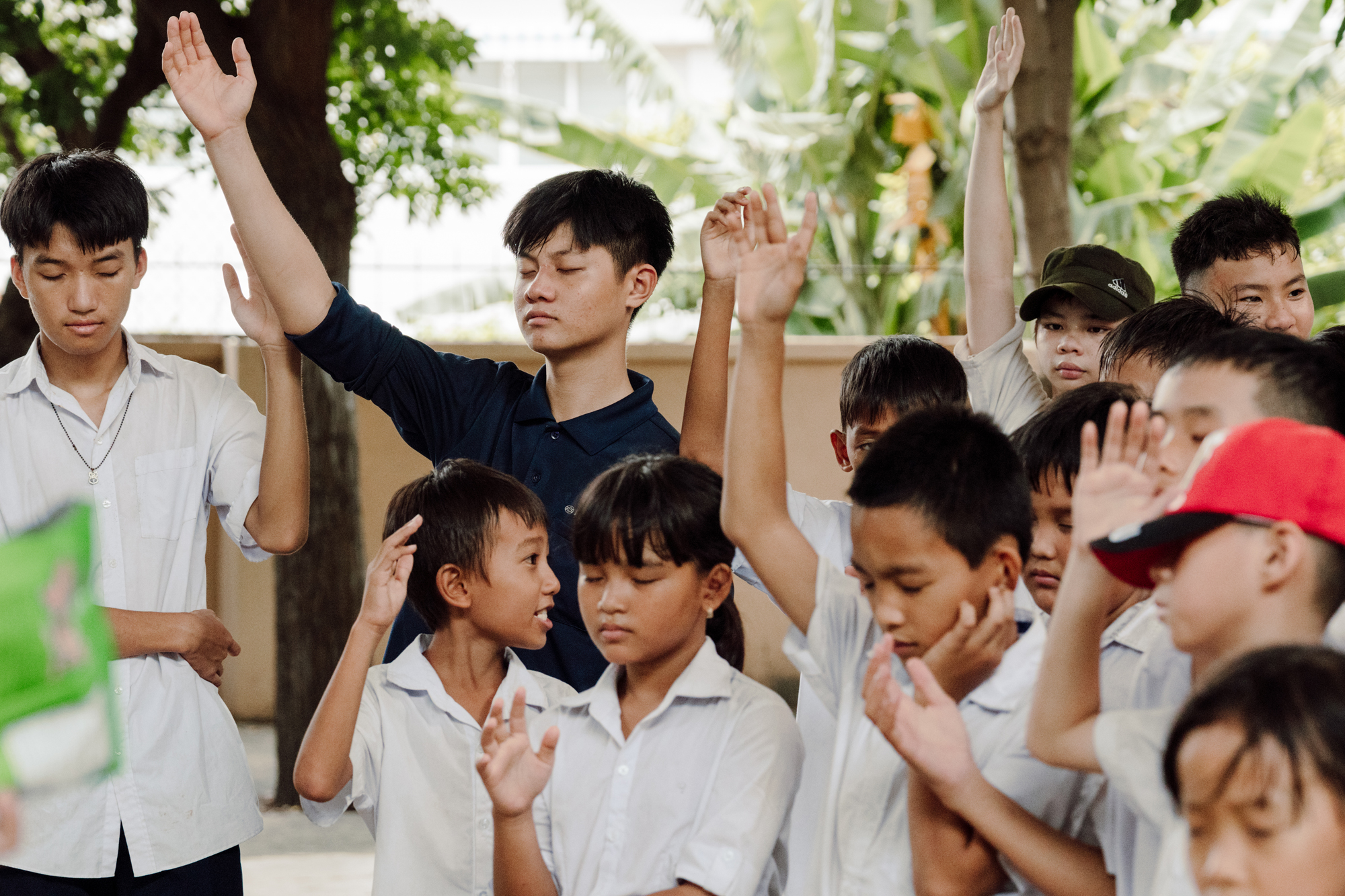 Vietnamese children praying and worshiping