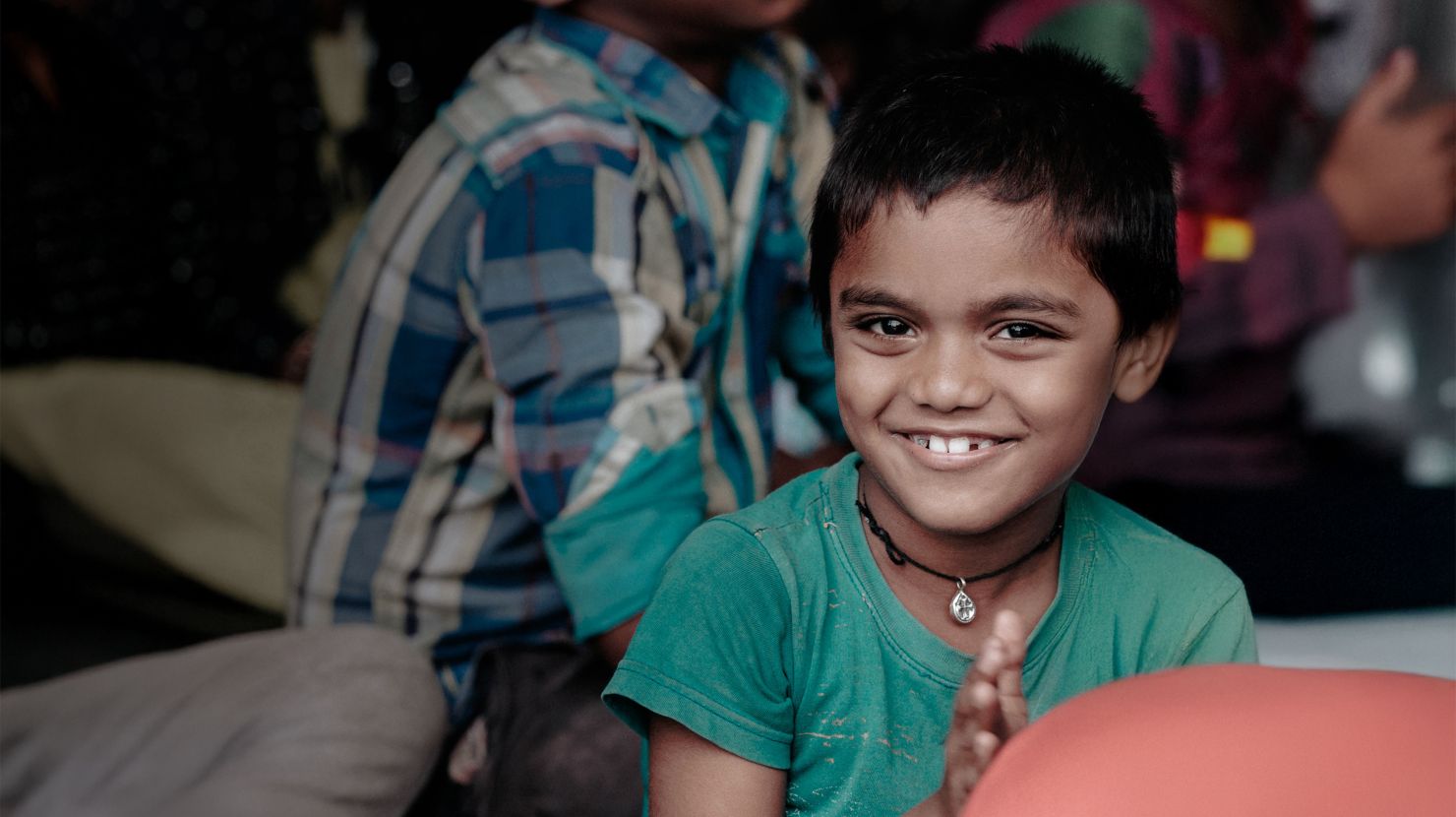 Smiling orphaned Indian boy