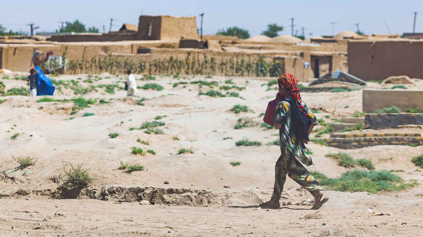 Central Asian child walking away