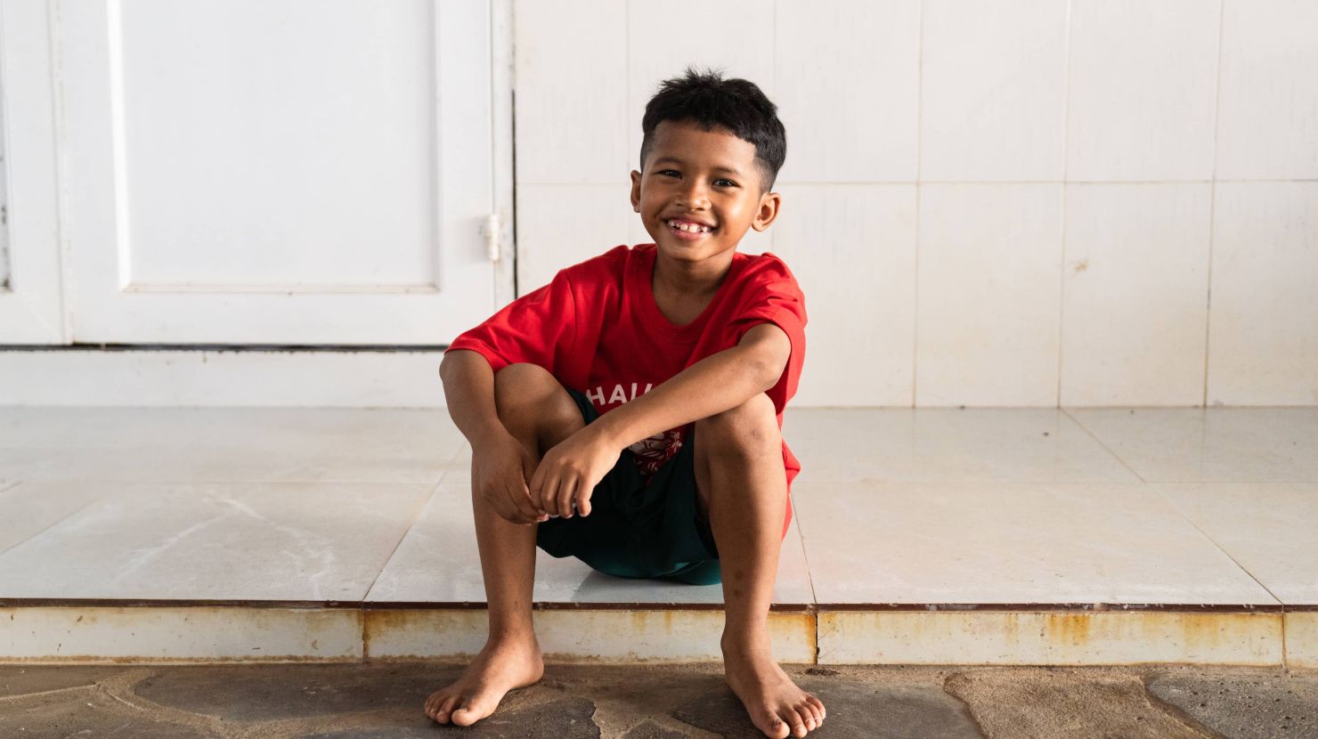 Image of a smiling orphan boy from Vietnam