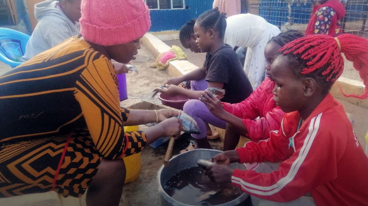 Woman teaching children in school setting