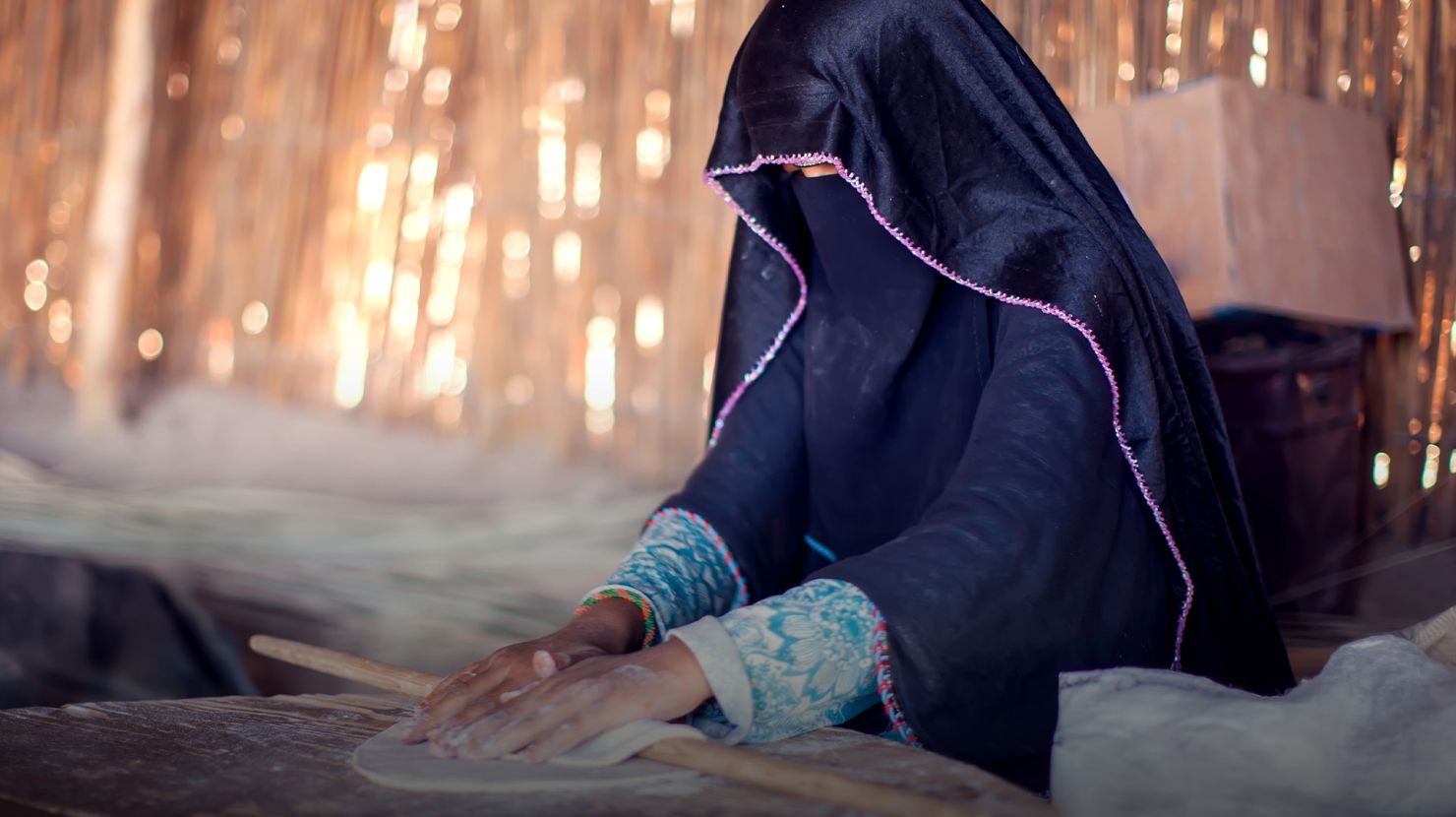 Woman rolling dough