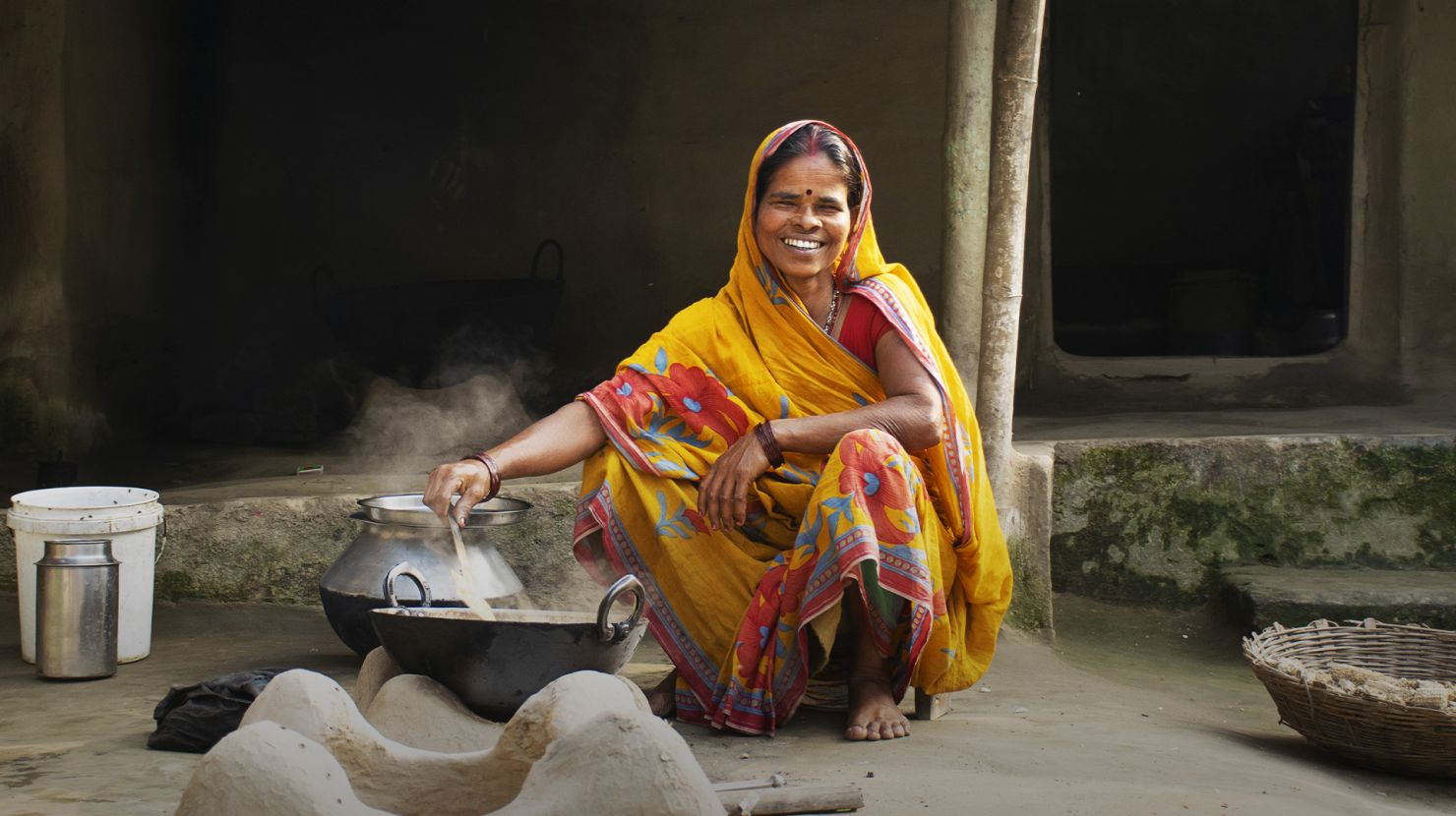 indian woman cooking outside
