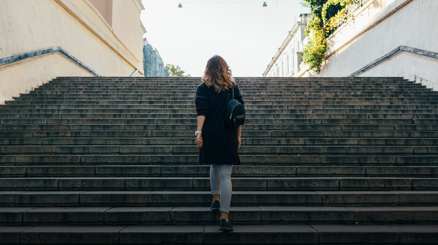 woman walking up the stairs