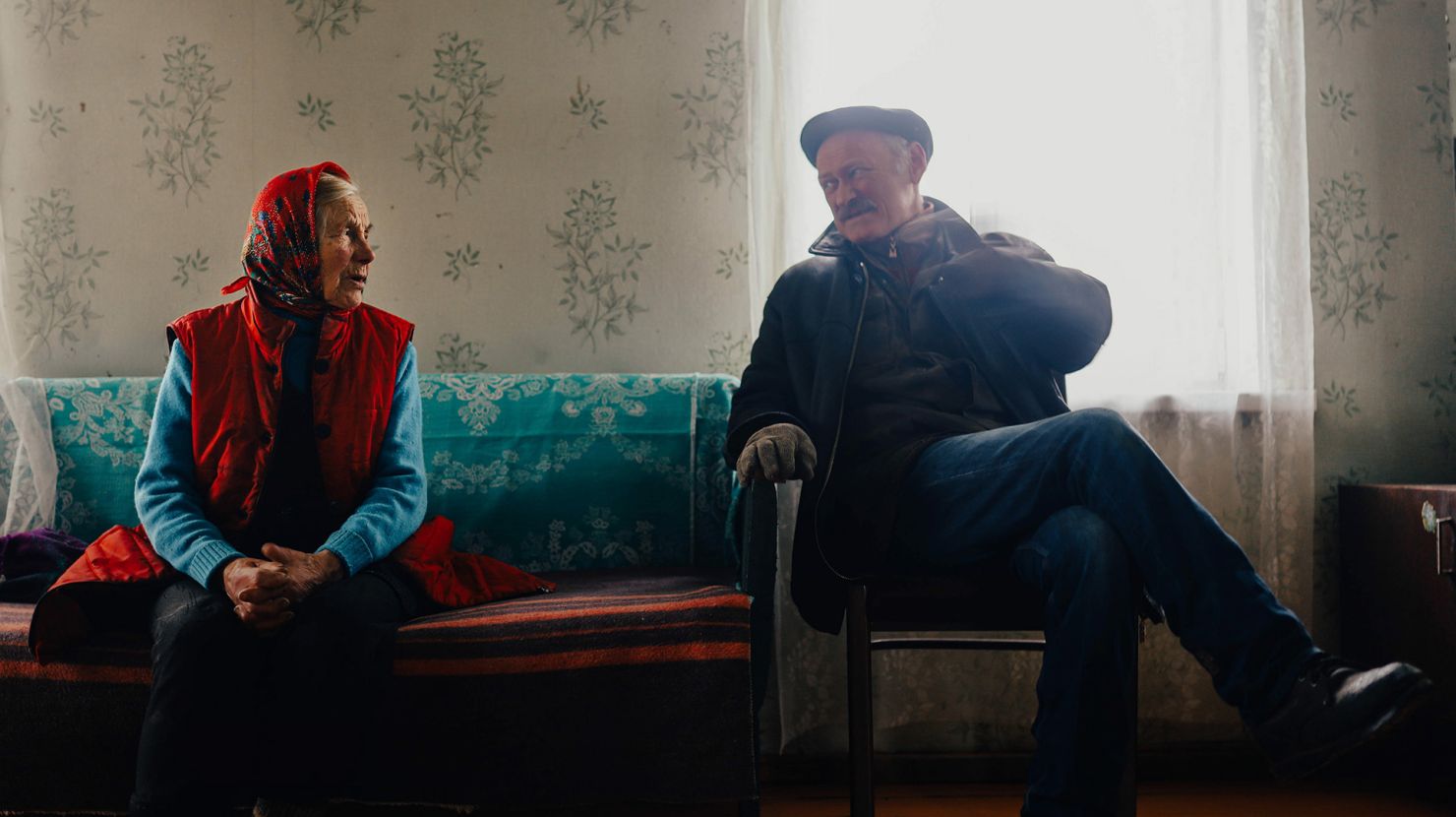 old man and woman talking
