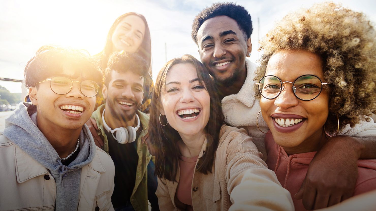 United group of happy young friends having fun while taking a selfie