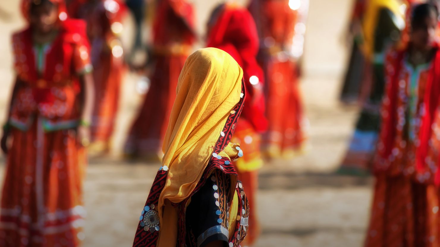 Girls in traditional Indian clothes dancing