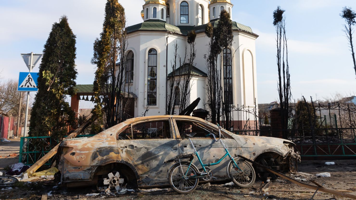 destroyed car on an Ukrainian road