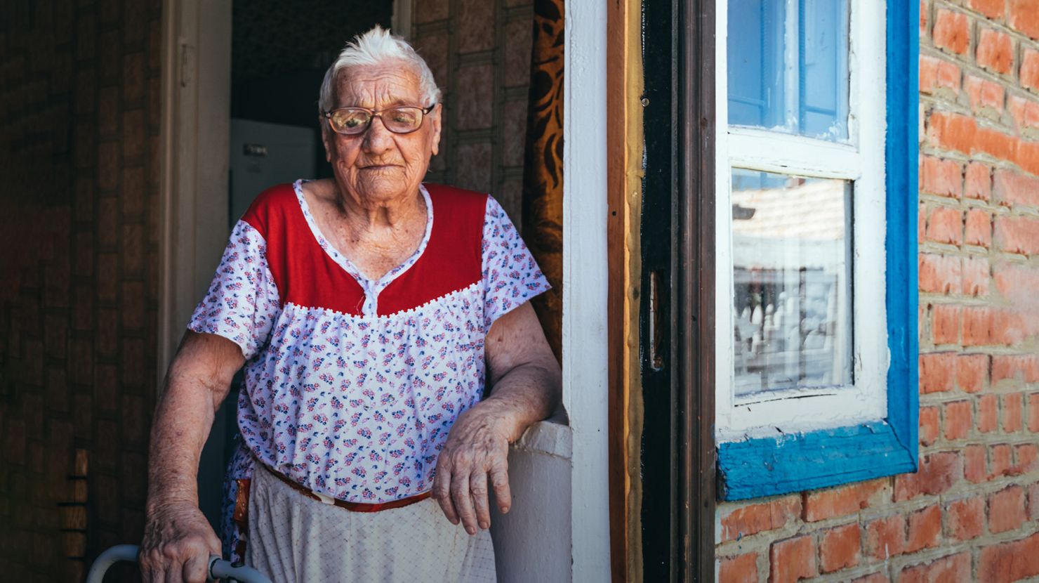 Portrait of a laughing hundred-year-old retired woman