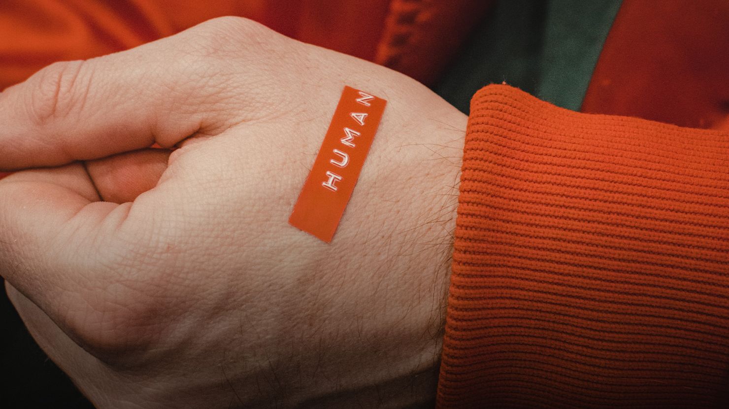 Human hand with human on a sticker