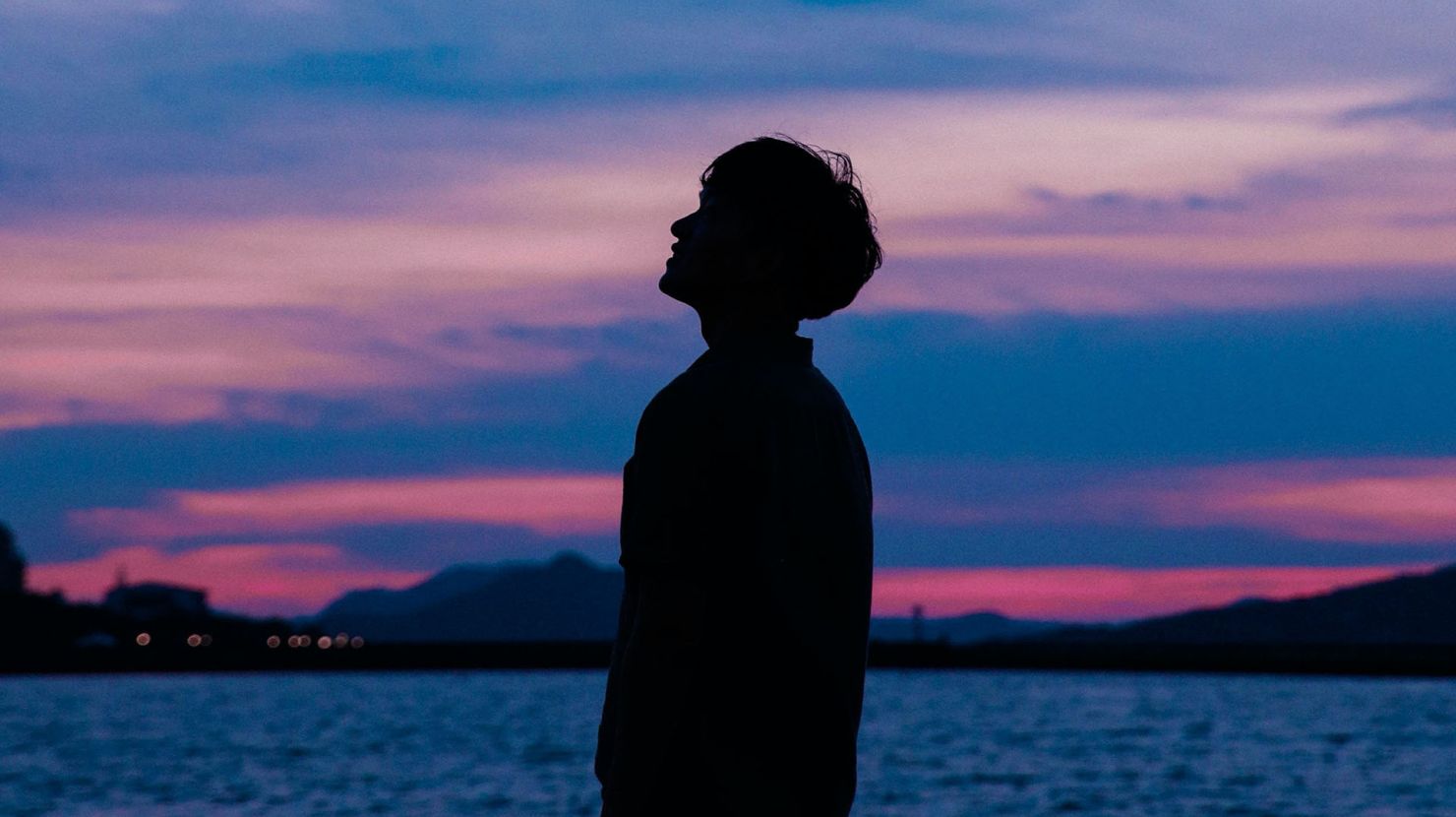 Man stares up at the sky