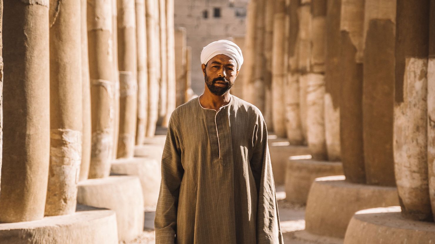Middle Eastern man standing outside