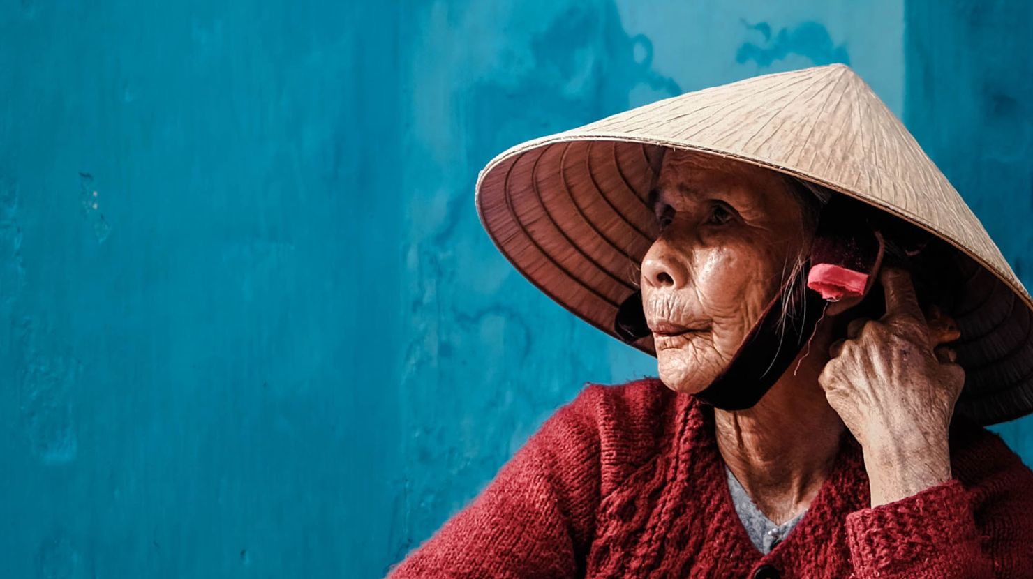 Elderly Asian woman looking off to the distance
