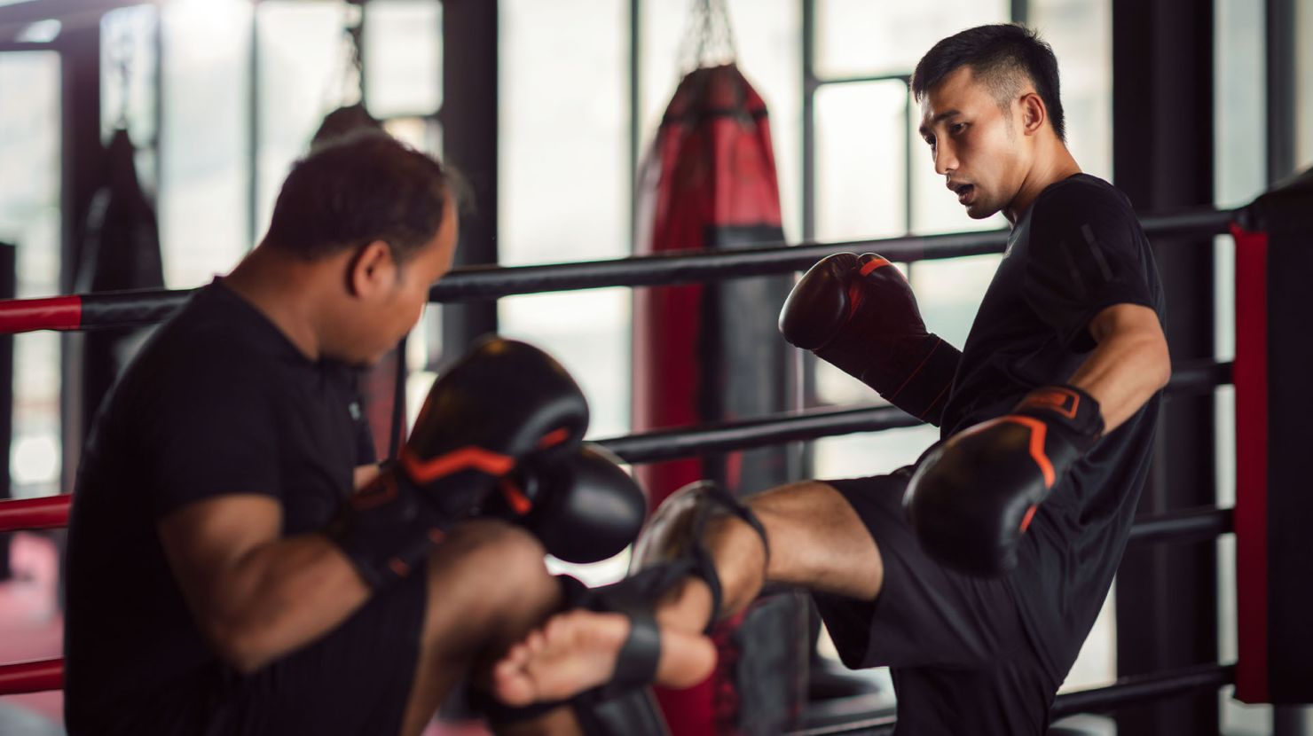 Two men kickboxing