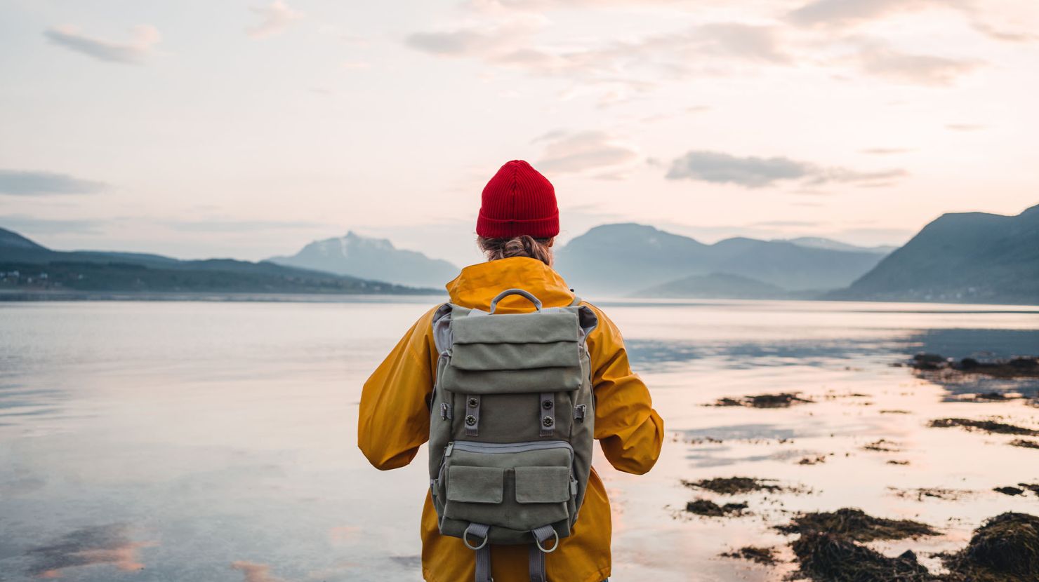 Man looking upon a lake