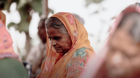 Women with head bowed